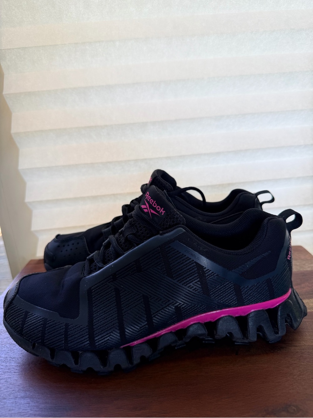 Reebok Women's Black Athletic Shoes with Pink Midsole Accents